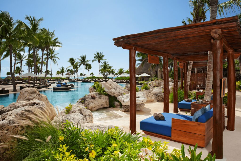 Pool side cabanas at Secrets Maroma