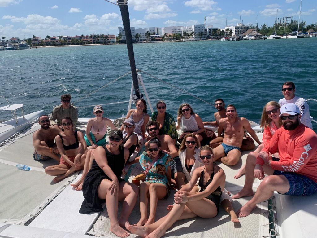 Wedding guests at wedding welcome party on catamaran