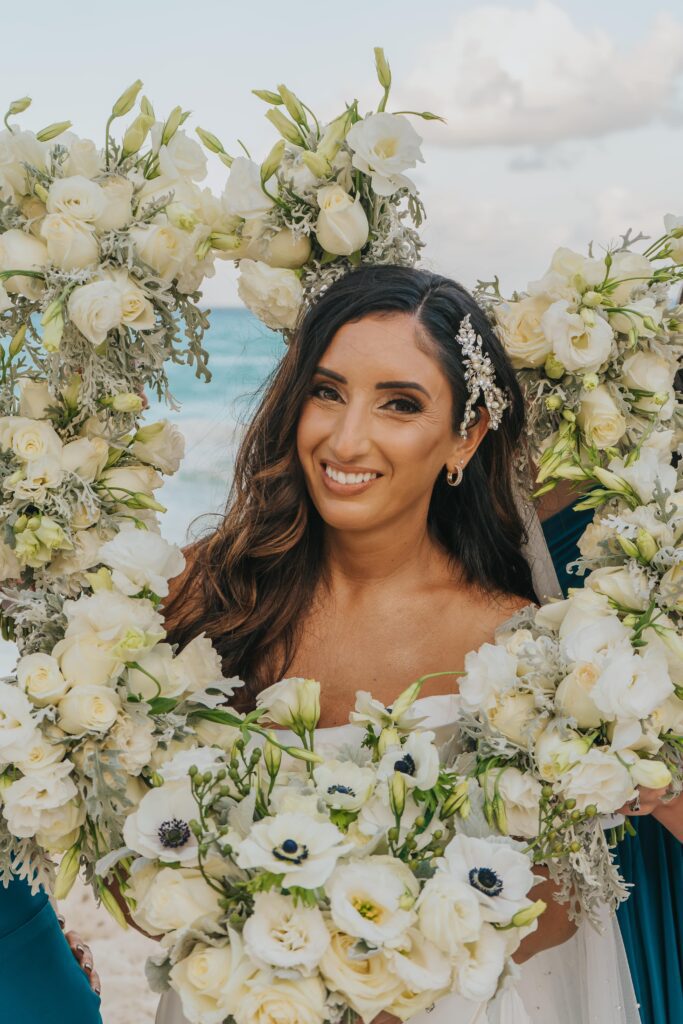 A halo of white flowers around a bride