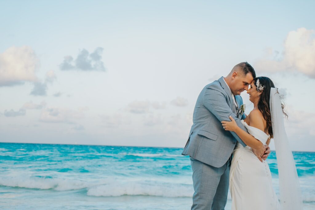 Bride and groom wedding portraits on the beach