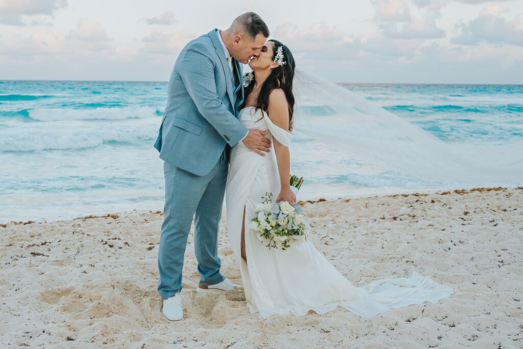 Bride and groom wedding portraits on the beach