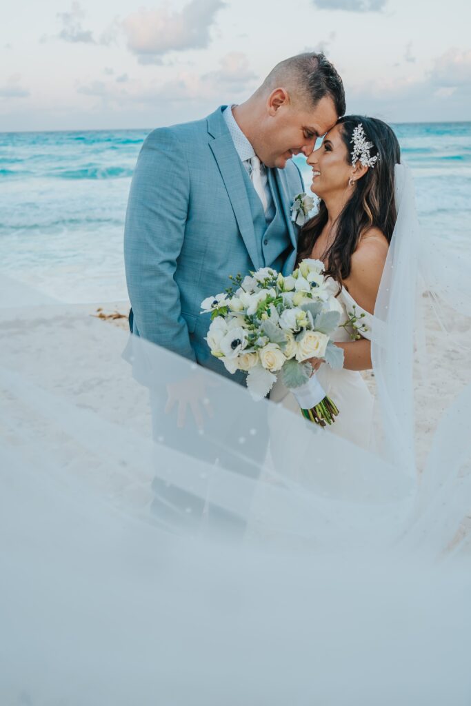 Bride and groom wedding portraits on the beach