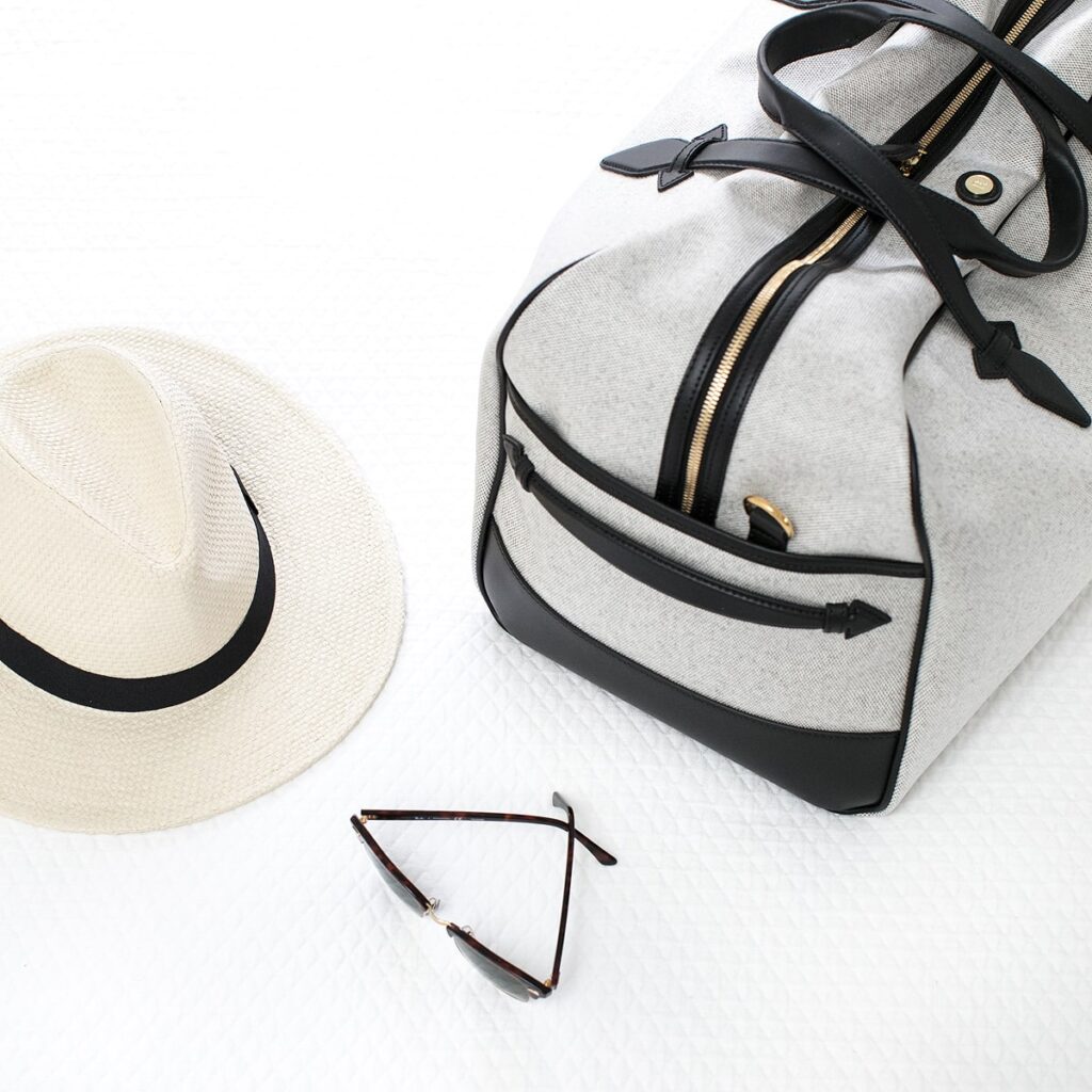 Grey luggage and hat