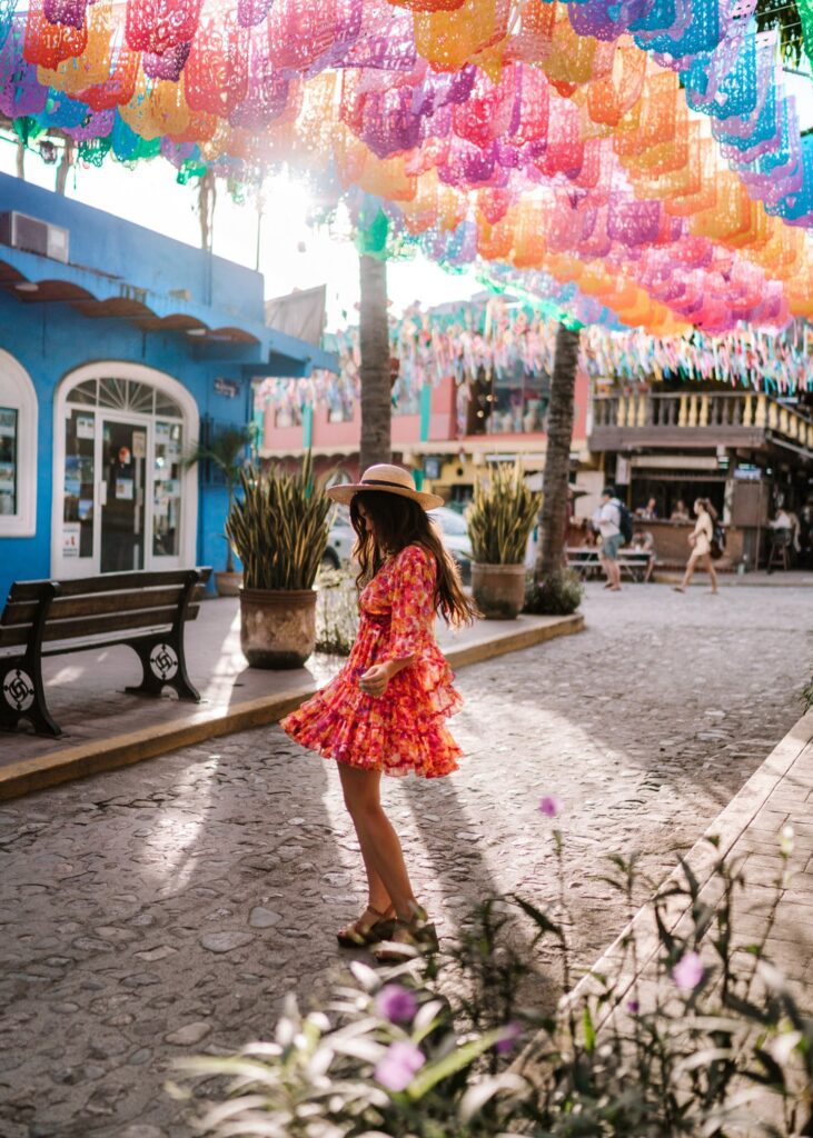 Women dancing under colorful Manners in Sayulita Puerto Vallarta