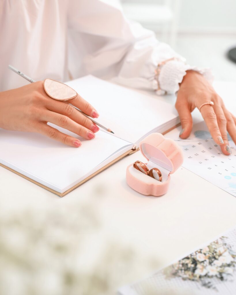Wedding planner writing in note book