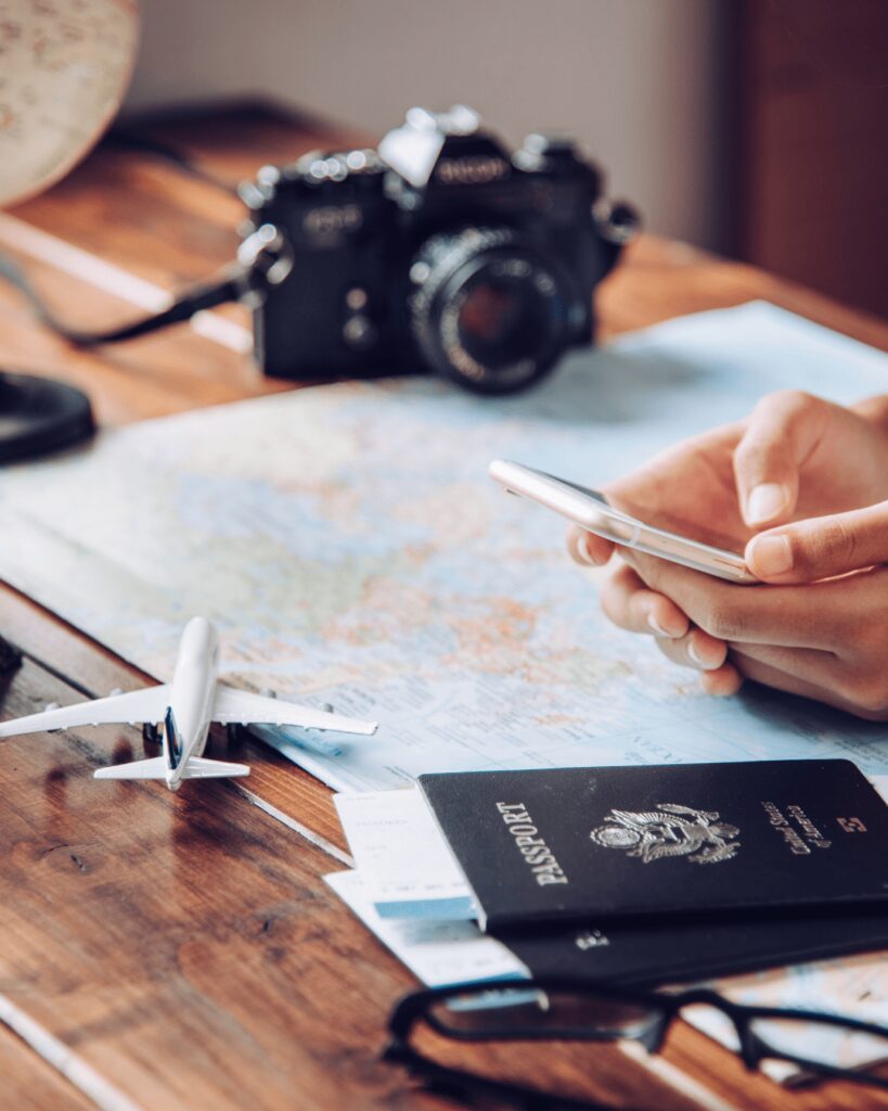 Destination wedding travel agent desk with map and passport