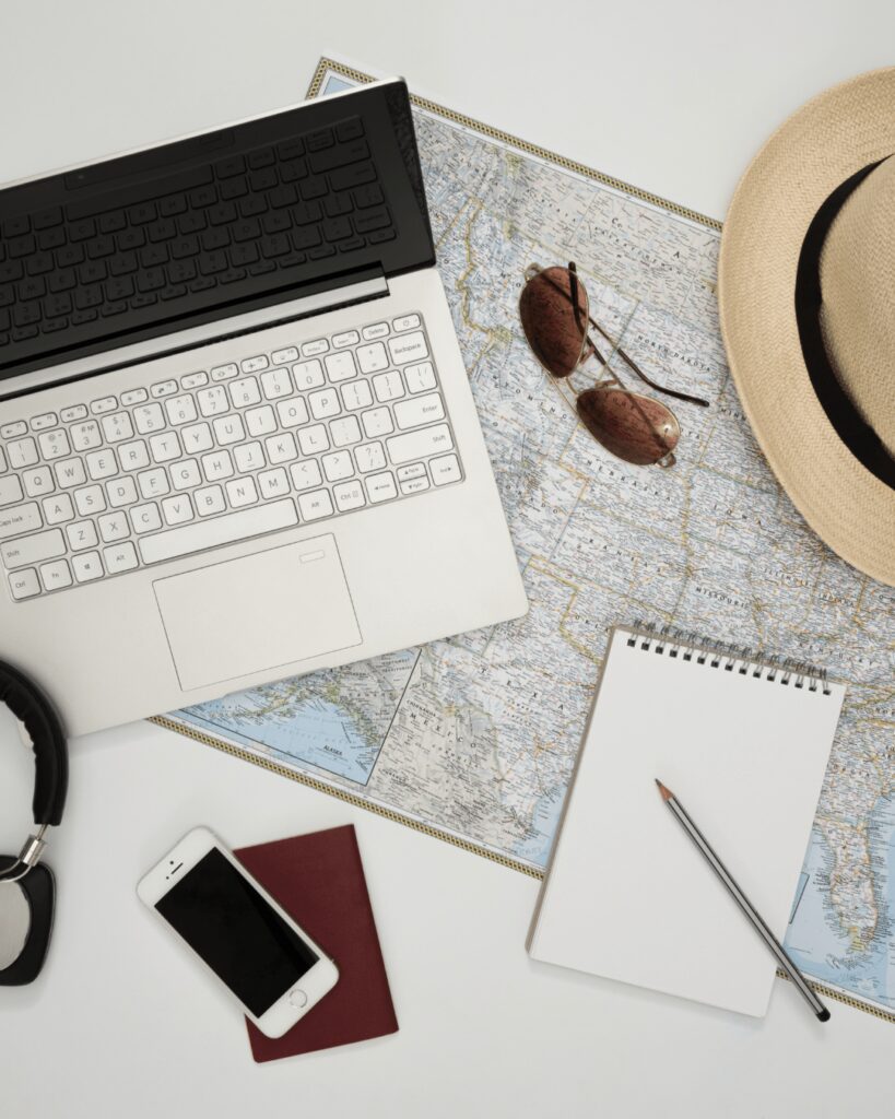 Destination wedding travel agent desk with map and computer