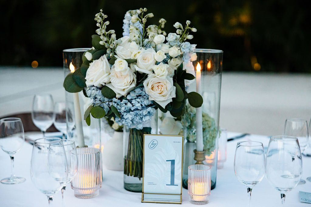 white wedding table with blue and white flowers
