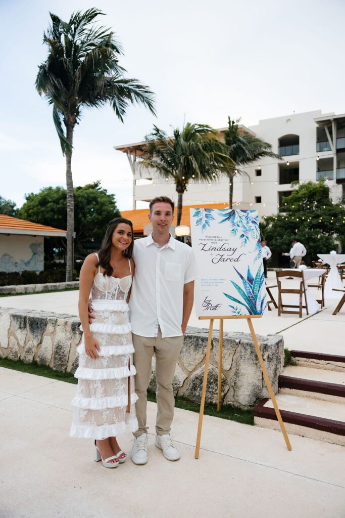 Bride and groom pose at their UNICO 20°87° Riviera Maya Wedding Welcome Party
