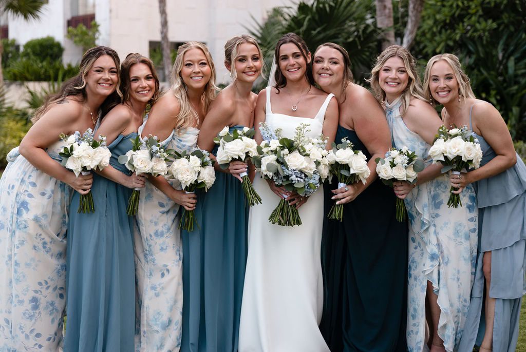 bridesmaids in mix matched blue and white bridesmaid dresses