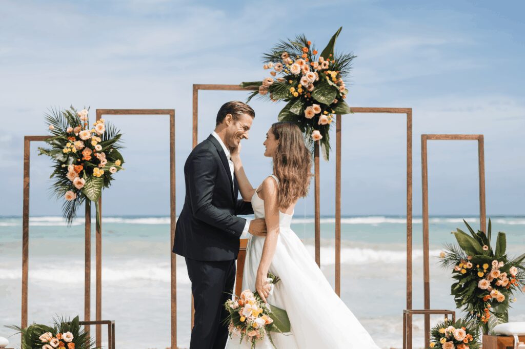 Beach wedding ceremony with window frame back drop at UNICO 20°87° Hotel Riviera Maya