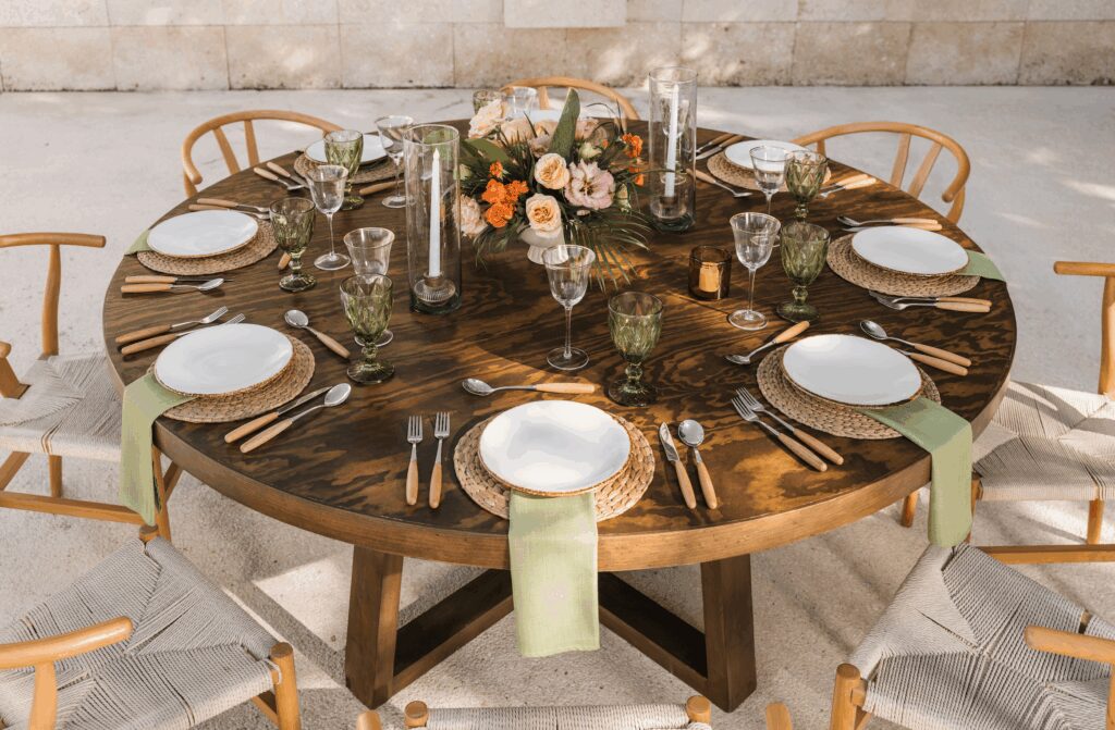 Wood wedding table with sage green napkins and florals at UNICO 20°87° Hotel Riviera Maya