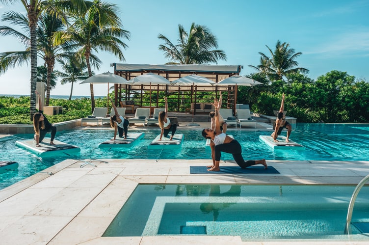 Yoga on the pool of UNICO 20°87° Hotel Riviera Maya