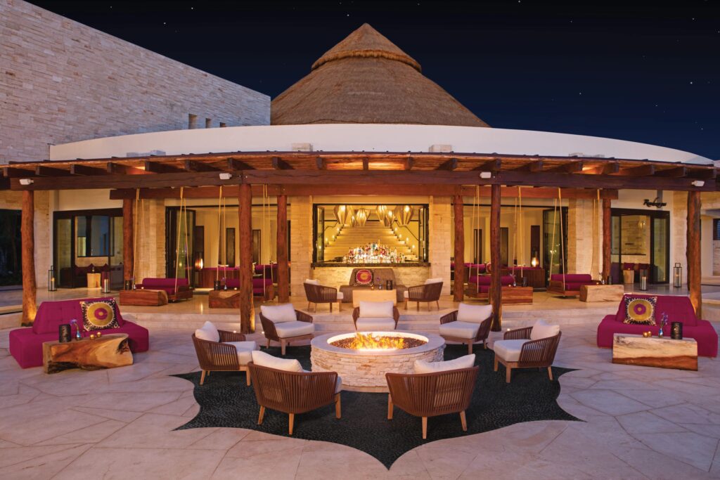 A patio and fire pit at an All-Inclusive resort