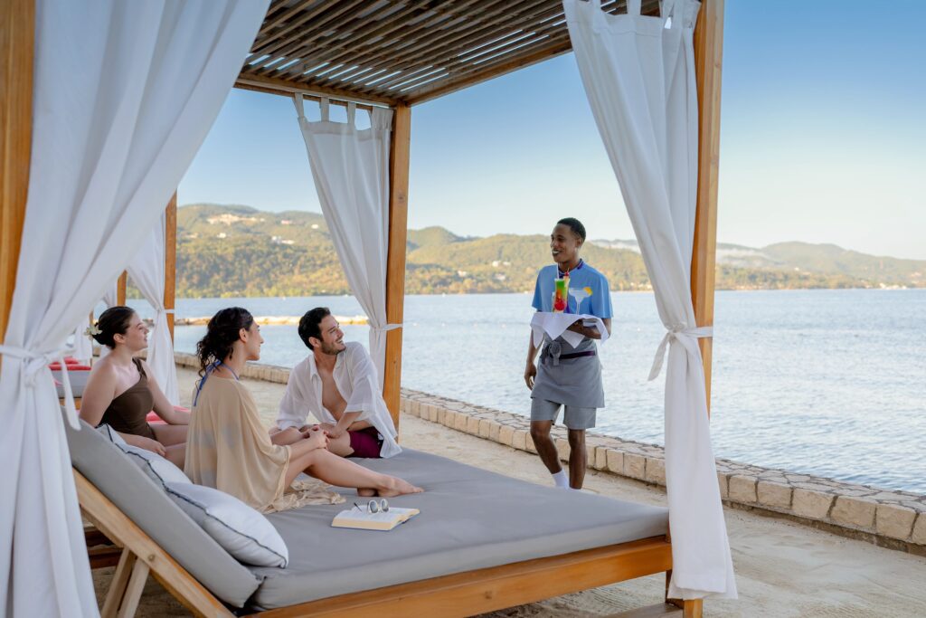 Pool side cocktail service in a cabana at an adults only All-Inclusive resort