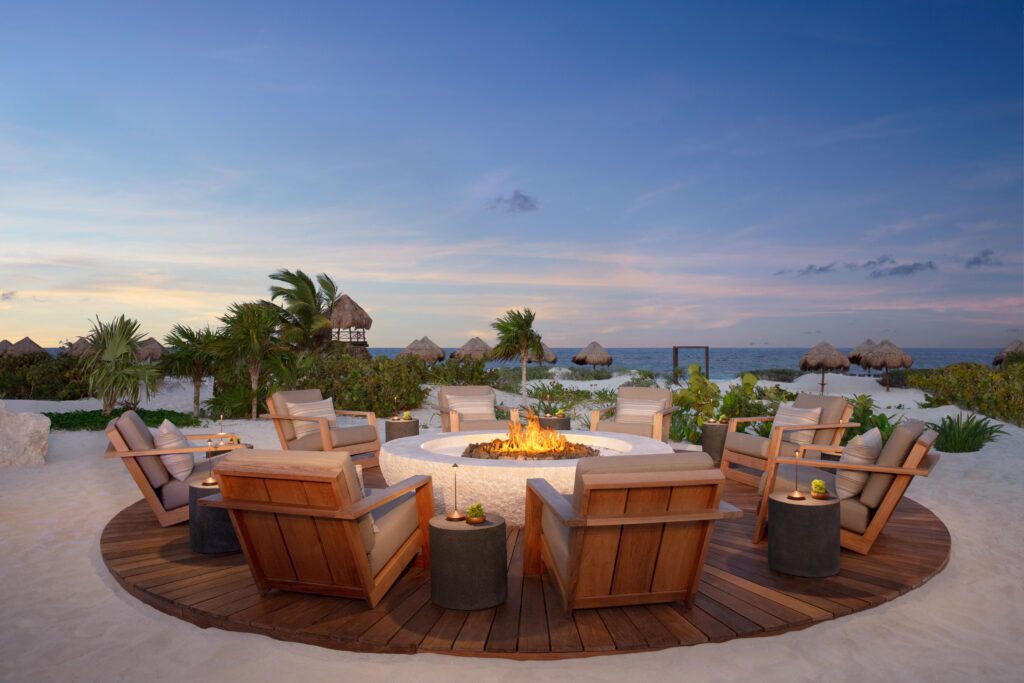 Fire pit with lounge chairs at all inclusive resort