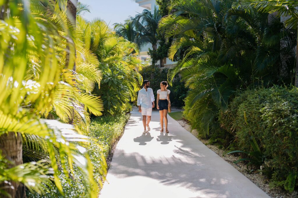 Engaged couple walking a Mexico wedding venue during a destination wedding site visit