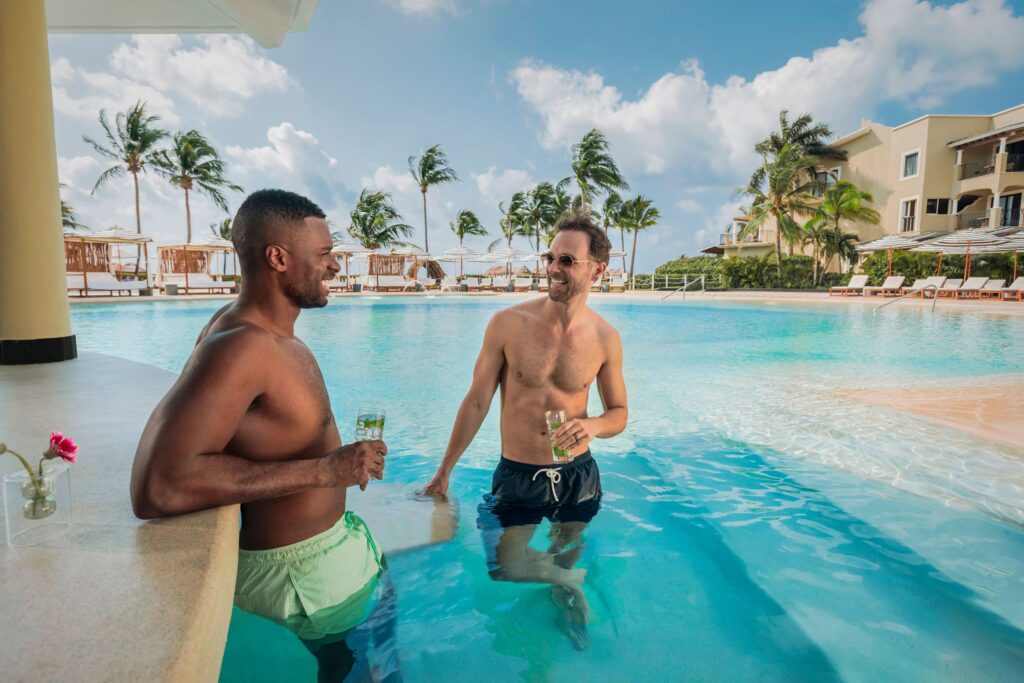 Men drinking at a swim up bar