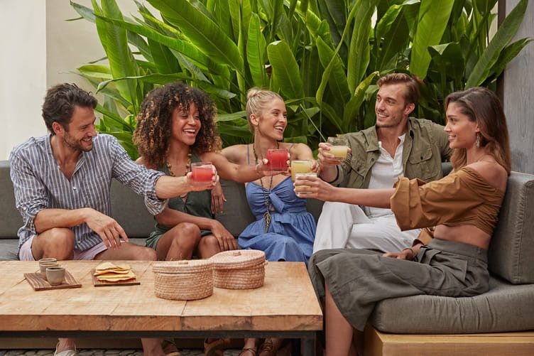 Guests cheersing at Unico Resort restaurant