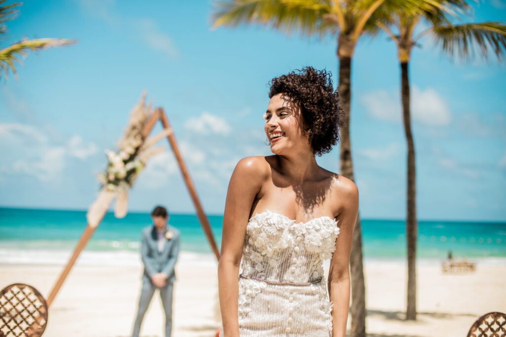 Bride posing at beach wedding ceremony