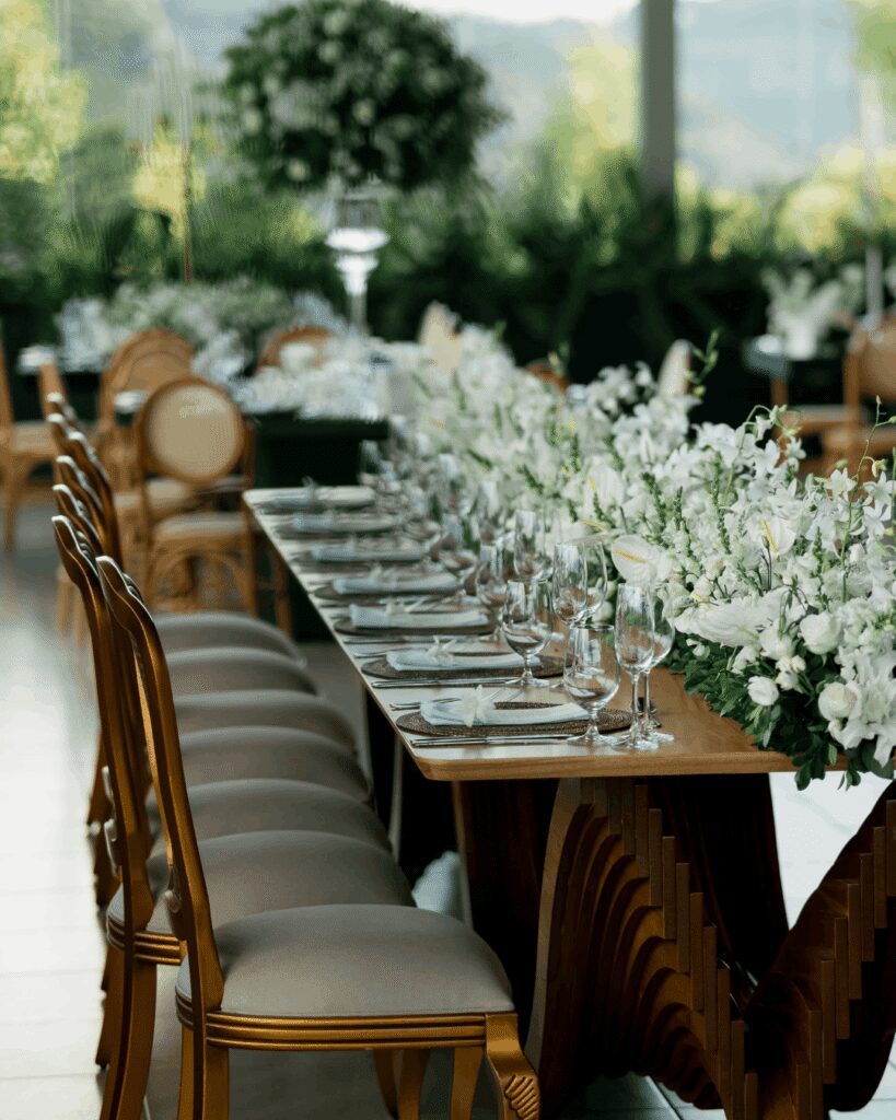 Long wood wedding table with white flowers