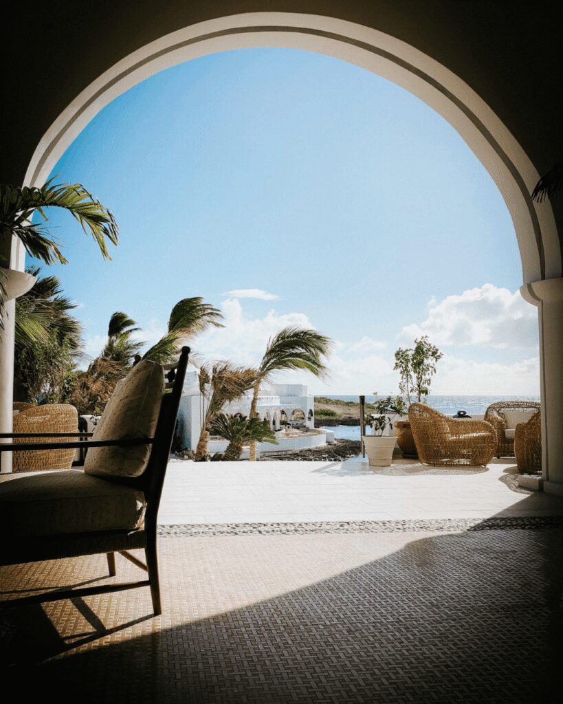 Arched lounge terrace overlooking the ocean at a wedding resort Arched lounge terrace overlooking the ocean at a wedding resort